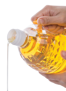 Oil being poured from a plastic container