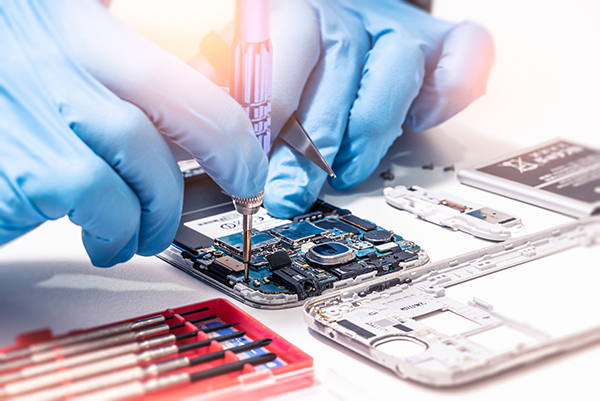 Close-up image of someone putting a mobile phone together